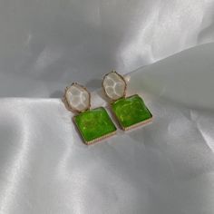 Don't miss out on these beautiful green and white drop earrings. They work with a large variety of looks and add a bit of sparkle to your outfit. MORE jewellery pieces available on our shop! Any questions please message we are happy to help. Free postage in UK Thank you for shopping with us Heather&Bumble 📪Follow us at: Instagram: heatherandbumble Twitter: Heather_Bumble Pintrest: Heather & Bumble Green and White Resin Drop Earrings - Green Earrings,White Earrings,Gold Earrings,Resin Earrings,Chunky Earrings In The UK,Green Jewellery Green Pierced Earrings For Party, Green Crystal Pierced Earrings For Party, Elegant Green Resin Earrings, Trendy Green Crystal Earrings For Gift, Trendy Green Drop Earrings, Elegant Dangle Resin Earrings, Elegant Resin Dangle Earrings, Elegant Light Green Earrings As Gift, Elegant Light Green Earrings For Gift