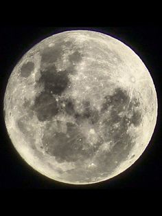 the full moon is shown in black and white