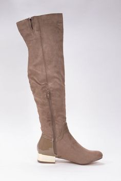 The London Taupe Over-The-Knee Boots are an absolute must-have! Soft vegan suede creates an almond-shaped toe upper, a 19.5" over-the-knee shaft, 1.5" heel height and a patent heel counter with chic metallic gold detail. Zipper at instep allows for easy on and off. Boots Color: Taupe Fit: True to size Over knee boots Shaft Height: 19.5" Heel Height: 1.5" Almond toe Metallic gold heel Patent heel detail Instep zipper Material: Vegan Suede Metallic Gold Heels, Over Knee Boots, Patent Heels, Almond Shaped, Gold Heels, The London, Gold Details, Over The Knee Boots, Over The Knee