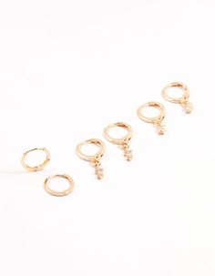 Elevate your look with this set of radiant, gold-toned hoop earrings, adorned with a dazzling cubic zirconia blend. Indulge in this stylish trio that lets you mix and match for endless accessorizing possibilities. Material: Cubic Zirconia Dimensions: Length 22mm x Width 3 mm | Lovisa Gold Dainty & Round Cubic Zirconia Hoop Earrings 3-Pack Cubic Zirconia Hoop Earrings, Elevate Your Look, Mix And Match, Cosplay Costumes, Cubic Zirconia, Hoop Earrings, Gold