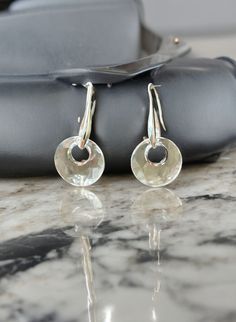 Elevate your everyday style with our stunning 14mm Clear Swarovski "Victory" Earrings, the perfect blend of elegance and simplicity. Handcrafted, these earrings feature 14mm clear Swarovski "Victory" crystals that catch the light beautifully, adding a touch of sparkle to any outfit. Whether you're heading to the office, running errands, or enjoying a night out, these versatile earrings are designed for everyday wear and effortlessly transition from day to night.  Ideal gift for any occasion. Round Earrings With Shiny Finish For Anniversary, Modern Silver Round Cut Earrings, Polished Sterling Silver Round Cut Earrings, Silver Faceted Earrings For Anniversary, Faceted Silver Earrings For Anniversary, Silver Round Cut Earrings For Everyday, Sterling Silver Faceted Earrings For Anniversary, Faceted Sterling Silver Earrings For Anniversary, Everyday Style