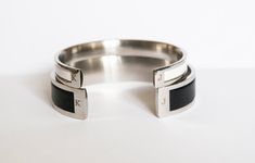 "Beautiful wedding gift for Couples. Set of two Matching Cuff Bracelets. Amazing, unique Stainless Steel cuffs with Genuine Leather Inlay. Made with Genuine high quality European leather and high quality Stainless Steel. Perfect, meaningful, special couples anniversary gift, valentines gift, wedding gift, birthday gift. ✧ 100% Handcrafted ✧ Absolutely Unique ✧ Hypoallergenic ✧ High Grade Surgical Stainless Steel (will not rust or tarnish) ✧ High Quality Genuine Leather Inlay ✧ Gift-ready in a cu Modern Initials Wedding Jewelry, Modern Initials Jewelry For Wedding, Modern Engraved Bangle For Anniversary, Modern Stainless Steel Bracelet For Wedding, Modern Stainless Steel Bracelets For Wedding, Stainless Steel Cuff Bracelet Bangle For Wedding, Stainless Steel Bangle Cuff Bracelet For Weddings, Stainless Steel Cuff Bangle For Wedding, Initials Cuff Jewelry For Anniversary