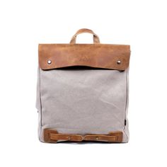 Our urban-inspired Cooper Canvas Backpack features a chic appearance and offers a roomy interior that lets you tote all your essentials. A single shoulder strap and a top loop give you versatile carrying options that can convert from backpack to crossbody in seconds..Material- vegetable base dyes, interior cotton lining, cotton canvas, genuine leather accents; hardware- alloy, solid brass or copper.Small sized bag, 12' W x 15' H x 5' D.Handle drop- 3', shoulder strap drop- 24'.Zipper closure.Interior- cotton lining, 2 zipper pockets, 2 slip pockets, 2 pen or pencil slots, key-ring, stitched on TSD brand logo patch.Exterior- top handle, embosed TSD brand logo, 1 zipper pocket, adjustable and detachable shoulder strap, silver-tone hardware.Weight- 1lb.Laptop compatible (std. size 13”-15”).Cl On-the-go Coated Canvas Backpack, Rectangular Coated Canvas Backpack With Removable Pouch, Modern Coated Canvas Shoulder Bag For On-the-go, Casual Coated Canvas Satchel For On-the-go, Modern Coated Canvas Standard Backpack, Modern Laptop Backpack With Adjustable Strap, Modern Leather Canvas Bag For On-the-go, Casual Duffle Bag With Leather Handles For On-the-go, Functional Canvas Backpack With Removable Pouch