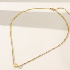 Durable and stylish, our waterproof necklace is crafted for both functionality and fashion. Perfect for any occasion, it's the ideal accessory for those who appreciate durability and timeless elegance. Perfect for the minimalist and a beautiful piece to layer with. A true versatile statement piece that you can wear straight from the pool to dinner! - 18K gold plated / stainless steel - Waterproof technology - 18" in length - Necklace + 1 cube (initial or sign) = $45 - Additional cubes with lette Simple Everyday Necklace With Delicate Chain, Simple Necklace With Delicate Chain Choker, Simple Chain Choker Necklace As Gift, Long Clavicle Chain Choker As A Gift, Simple Choker Necklace With Delicate Chain, Simple Choker With Delicate Chain, Minimalist Charm Necklaces With Delicate Chain Choker, Minimalist Box Chain Charm Necklaces For Everyday, Minimalist Box Chain Charm Necklace For Everyday