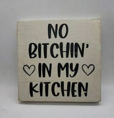 Add a touch of personality and charm to any space with this handmade wood sign featuring the fun phrase, "No Bitchin' In My Kitchen". Crafted from 100% repurposed and recycled wood, this sign measures 5 1/2 inches by 5 1/4 inches, making it the perfect size for any nook or cranny that needs a little extra flair. #homedecor #nobitchin #kitchen #funnysign #humor #humoroussign #woodsign #tieredtray #shelfsitter #wood #inmykitchen #selfstanding Handmade Wood Signs, Decor Shelf, Good Luck To You, Inexpensive Gift, Shelf Sitter, Recycled Wood, My Kitchen, Tiered Tray Decor, Funny Signs