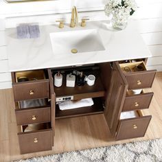 a bathroom vanity with drawers and a sink