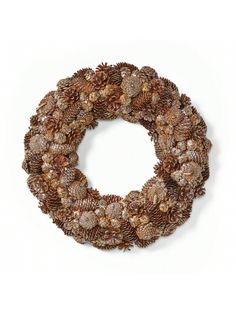 a wreath made out of pine cones on a white background