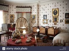 an old fashioned bedroom with antique furniture and wallpaper