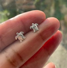 Turtle Stud Earrings -  tiny lightweight stud earrings which are perfect for everyday wear. + Sterling Silver studs with sterling silver back stoppers  + Turtle measures 8mm x 8mm + Will come complete in organza pouch and box If you like these earrings then please feel free to see similar and click below:- https://www.etsy.com/uk/shop/Instyleglamour?ref=hdr_shop_menu&search_query=sterling+silver+earrings  20% OFF COUPON CODE LINK BELOW!  http://eepurl.com/g_Jkif Cool Earrings Studs, Aesthetic Earrings Studs, Cute Earring Studs, Sea Turtle Earrings, Cute Animal Earrings, Hypoallergenic Huggie Earrings Gift, Personalized Sterling Silver Earrings For Everyday, Tiny Huggie Sterling Silver Earrings, Adjustable Huggie Earrings As Gift