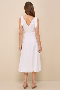 Your trend-setting wardrobe just wouldn't be complete without an essential look like the Lulus Charming Tendencies White Surplice Wrap Midi Dress! Lightweight linen-blend woven fabric shapes this sweet dress that features a sleeveless bodice with a flirty surplice neckline, a V-cut back, and long straps that tie at the shoulders. The flattering wrap silhouette features slender ties that secure at the side, before falling to a chic midi hem. Fit: This garment fits true to size. Length: Mid-calf l Elegant A-line Sundress With Tie Back, Spring A-line Midi Dress With Tie Straps, Chic A-line Sundress For Daywear, Elegant V-neck Sundress For Brunch, Unlined A-line Midi Dress For Summer, Elegant Midi Dress With Tie Straps, Cotton V-neck Dress For Brunch, Elegant Midi Dress With Tie Straps For Brunch, Knee-length Maxi Dress With Tie Back For Brunch