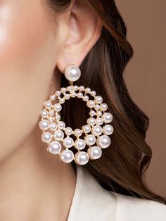 This statement accessory is literally drop-dead gorgeous! The Chopar Earrings are grand, meticulousy crafted and look stunning on almost any attire. The pearls going big to small, shape around one's face perfectly. Whether it's a wedding party or a lovely formal sit down dinner - these earrings are perfect. Earring Width: 5.7 cm Earring Height: 7.7 cm Total Weight: 50 grams Material: Pearls, Crystals, Brass & 18K Gold Plating Closure: Butterfly Back Sit Down Dinner, Big Pearl Earrings, Big Pearl, Jewelry Earrings Dangle, Sell On Etsy, Wedding Party, Dangle Drop Earrings, 18k Gold, Dangle Earrings