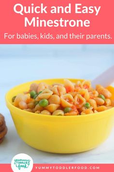 a yellow bowl filled with macaroni and peas next to cookies on a table