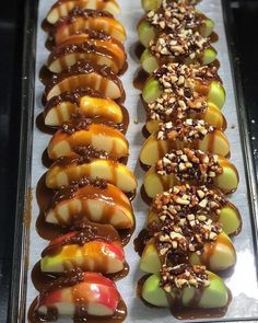 there are many desserts on the tray ready to be eaten