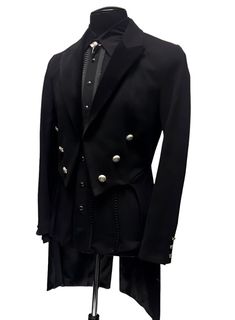 A formal Victorian coat with tails. Great for special occasions, formal events, or when you want to stand out from the crowd. Heavy brushed black denim fabric with luxurious black velvet lapels. Fully lined in rich black satin. Six ornate metal buttons decorate the front and two at the waist in back. Three smaller metal buttons are at each cuff. Comes in sizes Small-3X. I love this one!! Measurements: Small - Chest 40" Waist 30-34" Medium - 42-44" Waist 32-38" Large - Chest 46" Waist 36-40" XL - Tailored Long Black Blazer Coat, Tailored Black Tuxedo For Winter, Black Winter Tuxedo, Black Tuxedo For Semi-formal Occasion, Black Tailored Tuxedo With Buttons, Black Tuxedo Style Fall Outerwear, Black Blazer For Fall Costume Party, Black Tuxedo For Fall, Luxury Black Tuxedo For Fall