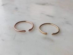 Minimalist Adjustable Open Band Ring, Dainty 14k Gold Open Midi Rings, Dainty Everyday Stackable Rings With Open Band, Dainty Everyday Stackable Open Band Rings, Delicate Everyday Toe Ring, Dainty Adjustable Midi Rings For Everyday, Dainty Stackable Open Band Midi Rings, Delicate Everyday Toe Ring Midi Ring, Simple Open Band Jewelry For Everyday