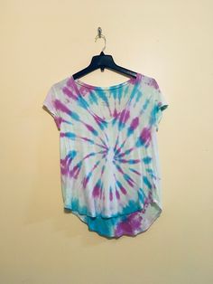 Hand tie dyed top size small, very soft Spring Faded Bleached Top, Faded Bleached Top For Spring, Spring Tie-dye Washed T-shirt, Spring Washed Tie Dye T-shirt, Casual Tie-dye V-neck Tops, Casual Tie Dye V-neck Tops, Spring Tie-dye Washed Top, Summer Acid Wash V-neck Top, Blue Casual Watercolor Print Top