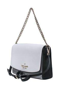 Get ready to hit the town in style with Kate Spade's polished Carson Crossbody. Its edgy gold-tone hardware pops against the sleek white, grey and black leather. Perfect for on-the-go fashion, this colorblocked accessory adds a touch of fun to any outfit. Leather Magnetic snap closure Internal slip pocket Exterior pocket Gold-tone hardware Chain-link handle Adjustable strap Width 9" Height 7" Depth 1.5" Chain handle drop 6" Strap drop 21" Classic Wardrobe Staples, Black Leather Crossbody Bag, Buy Shoes Online, Kate Spade Accessories, Kate Spade Purse, White Bag, Leather Crossbody Bag, Wardrobe Staples, Leather Crossbody