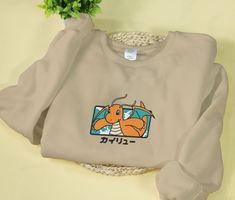 a sweatshirt with an image of a dog on it and japanese writing in the background