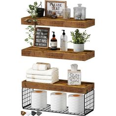 three wooden shelves with towels, toilet paper and other bathroom items on top of them