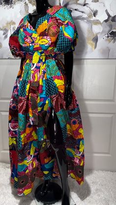 The ADESUA African Print Puff Sleeve Ball Gown is the perfect dress for your holiday celebrations. A stunning dress for any occasion really! Bold, colorful, stylish, and sassy. An Arican patchwork print dress that deserves a spot in your amazing closet. Look Unique. Know You Are Beautiful. Available in sizes S-2XL Colorful Patchwork Print Puff Sleeves Two Side Pockets Fully Lined  Cloth Belt CARE Hand Wash Or Machine Wash On Cool Gentle Cycle. Line Dry, Steam Iron. Multicolor Long Party Dress, Multicolor Maxi Dress For Casual Wear, Multicolor Maxi Length Dress, Multicolor A-line Party Dress, Multicolor Floor-length Party Dress, Multicolor A-line Maxi Dress For Party, Holiday Ruffled Midi-length Dress, Holiday Ruffle Midi Dress, Multicolor Short Sleeve Evening Maxi Dress