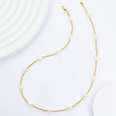 Elevate your neckline with our classic Pearl Clavicle Necklace! Versatile for both single and layered wear, this timeless piece also serves as the perfect chain for showcasing your favorite pendants. Don't miss out on the elegant beauty and endless styling possibilities of this must-have accessory! Material: 925 sterling silver plated with 18K gold, freshwater pearlsPearl: rice-shaped 4mmChain length: 38+3+3cm Elegant Layered Necklace With Adjustable Chain, Elegant Round Layered Necklace With Adjustable Chain, Pearl Choker Necklace With Chain, Pearl Choker Necklace With Chain Detail, Elegant Double Strand Metal Layered Necklace, Elegant Long Necklace With Cable Chain, Elegant White Chain Necklace With Delicate Chain, Delicate White Clavicle Chain Necklace, Elegant White Delicate Chain Necklace