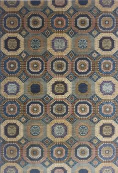 a blue and brown rug with many circular designs on the front, in different colors