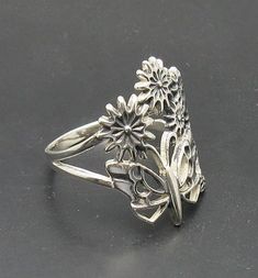 Sterling silver ring 925/1000, butterfly and flower .Stamped 925. Approximate weight 3.2 grams. Top width 2.2cm. All our jewels are made from solid sterling silver 925/1000 and are carefully crafted by hand in our family workshop. We dispatch your orders in 5 working days, worldwide and the postage is $5. We ship registered priority mail. Please allow 5-7 working days for delivery in Europe and 10-15 working days outside Europe. For any questions - please do not hesitate to contact me! Unique Sterling Silver Butterfly Open Ring, Unique Sterling Silver Open Butterfly Ring, Unique Sterling Silver Nickel-free Butterfly Ring, Unique Nickel-free Sterling Silver Butterfly Ring, Nickel-free Sterling Silver Butterfly Ring, Unique Butterfly Sterling Silver Ring, Silver Butterfly Ring For Anniversary, Vintage Sterling Silver Butterfly Ring For Anniversary, Sterling Silver Hallmarked Butterfly Wedding Ring