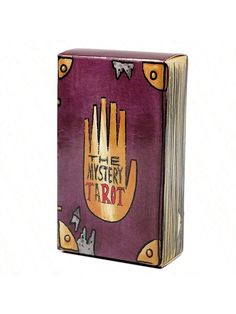 the mystery tarot book is open and has an image of a hand on it