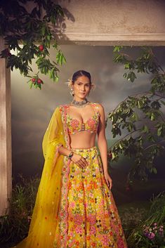 Featuring a primrose yellow silk lehenga embellished fully by hand with intricate foliage motifs featuring thread work, sequence, beads and colourful Japanese bugle beads. Paired with a matching blouse and dupattaFrom Aneesh Agarwaal's Ellora collection.DELIVERY TIMEPlease allow 8-12 weeks for your outfit to arrive.FABRIC DETAILSOrganzaProfessional cleaning only. Yellow Sharara With Intricate Embroidery For Party, Designer Yellow Lehenga With Floral Embroidery, Yellow Choli With Floral Embroidery For Reception, Bollywood Style Choli With Floral Embroidery In Art Silk, Yellow Floral Embroidered Sharara For Reception, Bollywood Style Art Silk Choli With Floral Embroidery, Bollywood Art Silk Choli With Floral Embroidery, Reception Yellow Floral Embroidered Sharara, Yellow Floral Embroidery Sharara For Reception