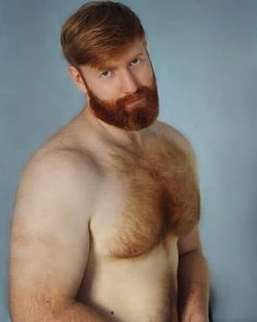 a shirtless man with red hair and beard