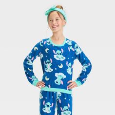 Bring the magic of a classic Disney hit to your kid's' wardrobe with this Lilo & Stitch 2-Piece Pajama Set and Headband in blue. This pack includes a headband, a long-sleeve sleep shirt with Lilo & Stitch prints designed with a crew neckline, and a pair of pajama pants with allover Lilo & Stitch prints for a fun, playful look. Tailored in a regular fit, this pajama set is great for movie nights and bedtime stories. Cozy Pajamas, Kids Wardrobe, Fleece Pajamas, Pajama Pant, Lilo Stitch, Stitch 2, Movie Nights, Print Pajamas, Classic Disney