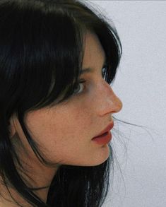 a close up of a woman with black hair