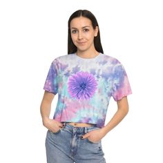 This icon of the 60s is back with a beautiful violet Dahlia flower printed on the front and back.  Made with 60% cotton and 40% polyester, this tee balances perfectly between comfy and stretchy, making it an excellent all-around choice for casual wearing. Each tee comes pre-shrunk for no size-related surprises after repeated washes, and features a drop shoulder sleeve for laid-back vibes.  .: 60% Cotton 40% Polyester .: Light fabric (5.4 oz/yd² (183 g/m .: Relaxed fit .: Sewn-in label Because this t-shirt is custom printed for your size, there are no returns or exchanges.  Please contact us with any issues. .: Shirt colors and pattern may vary Casual Tie Dye Tops With Floral Print, Spring Fitted Tie Dye T-shirt, Spring Fitted Tie-dye T-shirt, Casual Tie Dye Crop Top For Spring, Tie Dye Floral Print Summer Top, Tie Dye Floral Print Top For Summer, Tie Dye Short Sleeve Crop Top For Summer, Summer Floral Print Tie Dye Top, Spring Tie Dye Cropped Crop Top