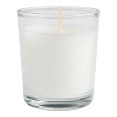 a white candle in a glass on a white background