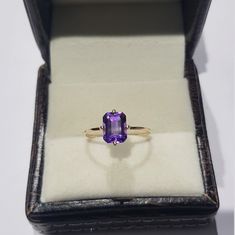 14k solid yellow gold natural emerald cut shaped amethyst gemstones ring. 1. The weight of the natural amethyst gemstone used in the ring =1.50 cts. 2. The weight of the 14k solid yellow gold used in the ring =1.170 grms. 3. The amethyst is the birthstone for the people born in the month of February. 4. The design of the ring is very nice and beautiful. 5. I have used all my skills and experience to manufacture this ring as beautiful as I can and I do hope that my work will be appreciated. Thank Month Of February, Beautiful Wedding Rings, Amethyst Gem, Tourmaline Stone, Purple Band, Green Sapphire, Aquamarine Gemstone, Ring Photos, Tourmaline Gemstone