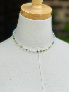 Enjoy the beauty of this handmade choker, featuring exquisite Peruvian opal stones. The chain showcases a stunning array of rich colors, from serene pale blues and aquas to vibrant greens and earthy tones. Measuring 16 inches in length with 2 " extension, this unique piece adds a touch of style to any outfit. Perfect for everyday wear or special occasions. Made with natural Peruvian Opal stones on gold over sterling silver wire. Dainty and lightweight. Natural stones may vary slightly in color. Bohemian Single Strand Choker Jewelry, One Of A Kind Adjustable Choker Necklace, Handmade Adjustable Amazonite Beaded Necklaces, Bohemian Adjustable Single Strand Choker, Handmade Adjustable Amazonite Beaded Necklace, Bohemian Single Strand Choker, Adjustable Single Strand Amazonite Beaded Necklace, Bohemian Single Strand Amazonite Jewelry, Bohemian Amazonite Single Strand Beaded Necklace