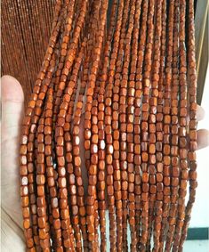 a bunch of beads that are brown in color