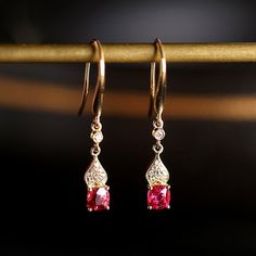 •Condition: Brand new•Center Stone: Natural Red Spinel, Cushion Cut, approx 1.6ct total, 5.5x4.5mm•Side stones: Natural White Diamond Round-cut (VS1 clarity and F color)•Earrings Dimension: 3.5 x 26 x 3mm•Metal Purity: Optional•Sell as pair Each piece is made-to-order with care and special attention to detail. all items are made with conflict-free diamonds and gems.Size: made to orderThe item will be gift wrapped and shipped.-------------------------------------------------------------------Avai Luxury Red Ruby Earrings, Red 14k Gold Pierced Earrings, Exquisite Red Ruby Earrings, Exquisite Ruby Red Earrings, Pink Oval Ruby Earrings, Rose Gold Ruby Earrings For Gifts, Elegant Ruby Earrings For Valentine's Day, Elegant Red 14k Gold Jewelry, Exquisite Red Earrings For Wedding