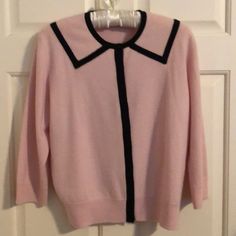 Neiman Marcus Pink Cashmere Buttoned Cardigan With Black Cashmere Trim. 3/4 Sleeves. Hidden Buttons Give Clean Line In Front Of Sweater. New Never Worn. Size Large. Chic Pink Sweater For Work, Classic Fitted Pink Cardigan, Fitted Classic Pink Cardigan, Pink Long Sleeve Sweater For Work, Classic Pink Tops For Fall, Classic Pink Spring Cardigan, Pink 3/4 Sleeve Top For Work, Classic Pink Sweater For Spring, Pink Fitted Classic Sweater