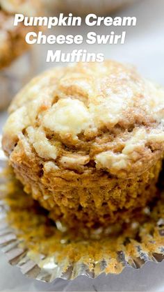 pumpkin cream cheese swirl muffins are sitting on a white surface with the words, pumpkin cream cheese swirl muffins