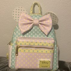 The Backpack Is Topped With Die-Cut Figural Ears, The Pastel Body Is Covered With Polka Dots On All Sides. A 3d Bow Adorns The Front, While The Inside Is Patterned With Minnie Mouse. There’s A Small Zipper Pocket Inside As Well. Approx. 9 1/4" W X 10 1/2" H X 5" D The Wallet Is Much The Same, With Die-Cut Figural Ears, The Pastel Body Is Covered With Polka Dots On All Sides. A 3d Bow Adorns The Front, While The Inside Includes An Id Card Slot. Approx. 8" W X 4" H X 1" D Both Are New With Tags No Loungefly Disney, Mini Backpack, Inside Pocket, Zipper Pocket, Minnie Mouse, Blue And Purple, Polka Dots, Dots, Bag Lady