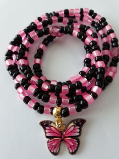 Waist beads made with 4mm black and matte hot pink glass seed beads, 6mm Czech glass beads, and enamel 'butterfly' charm. Beads are on sturdy elastic cord. Spiritual Pink Spacer Beads, Pink Jewelry With Adjustable Black Beads, Pink Spacer Beads For Gifts, Adjustable Pink Beaded Necklaces With Black Beads, Adjustable Pink Beaded Necklace With Black Beads, Adjustable Pink And Black Beaded Necklaces, Adjustable Pink Beaded Necklace With 108 Beads, Pink Spiritual Beaded Bracelets With Tiny Beads, Pink Jewelry With Black Beads For Gift