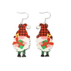 the earrings are decorated with plaid fabric and santa claus's hat, holding presents