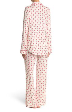 A soft jersey knit pajama set with a pretty print delivers feminine style and essential comfort. 2-piece set Shirt: 25" length (size S); Pants: 9.5" rise, 32" inseam (size S) Shirt: notch lapel, long sleeves, front button closures, chest patch pocket, allover print, contrast piping, knit construction Pants: elasticized waist, pull-on style, allover print, knit construction 95% rayon, 5% spandex Machine wash cold Imported Model’s stats for sizing: 5’11” height, 32” bust, 24” waist, 34” hips. Mode Casual Printed Long Sleeve Sleepwear, Casual Long Sleeve Printed Sleepwear, Long Sleeve Printed Loungewear Sets, Long Sleeve Printed Lounging Sets, Printed Long Sleeve Lounging Sets, Long Sleeve Printed Lounge Sets, White Printed Long Sleeve Sleepwear, Fitted Long Sleeve Tops For Sleepovers, Fitted Long Sleeve Sleepwear For Pajama Party