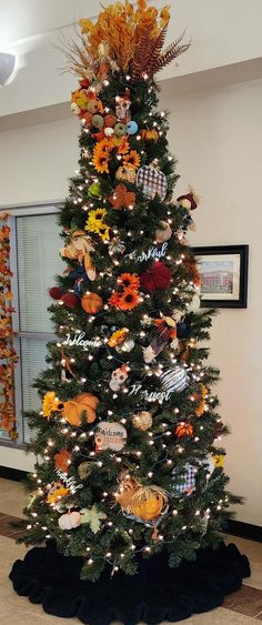 a decorated christmas tree in an office