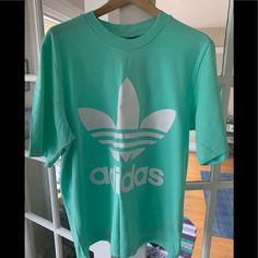 Adidas Mint Box Fit T-Shirt Never Been Worn W/Tags Size M Box Fit In Mint/Excellent/Flawless Condition 100% Cotton Smoke/Pet Free Home Deep Wrinkle/Wrinkles Will Come Out In Simple Machine Wash And Machine Dry Casual Green T-shirt With Adidas Logo, Trendy Adidas T-shirt With Letter Print, Green Adidas Tops With Logo, Adidas Green Sports T-shirt, Adidas Green T-shirt For Sports, Adidas Logo Athleisure Crew Neck Tops, Green T-shirt With Three Stripes Branding For Sports, Spring Adidas Logo Relaxed Fit Tops, Spring Adidas Logo Top With Relaxed Fit