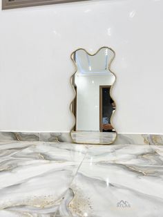 a mirror that is on the side of a wall