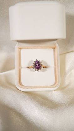 * Ring Material: Amethyst, Diamond, 14K Yellow Gold * Ring Dimensions: 11.8x14.3MM Top Design, 1.5MM Tapering Band * Size: 6.5 * Stone Weight & sizes: Amethyst - 1.70ct, Diamond - 0.20ct * Overall weight: 3.8g Purple Rose Cut Diamond Rings In 14k Gold, Purple 14k Gold Ring With Rose Cut Diamonds, Purple 14k Gold Rings With Rose Cut Diamonds, Wedding Yellow Gold Amethyst Ring With Halo Setting, Formal Amethyst Pear-shaped Ring, Pear-shaped Amethyst Rings With Accent Stones, Purple Pear-shaped Ring With Prong Setting, 14k Yellow Gold Amethyst Ring With Halo Setting, Fine Jewelry 14k Gold Amethyst Ring With Halo Setting