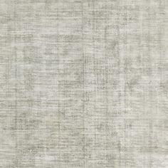 an area rug with white and grey colors