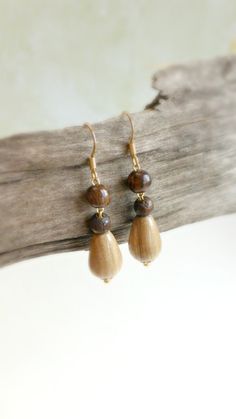 "Small teardrop wood earrings are dangling from stainless steel gold plated french wires hooks . The colors are light green teardrop and  brown  . Cute  pair of wood earrings - for earthy women ! Size : 1 \"  3/4 '  long             7 mm diameter" Brown Teardrop Jewelry For Gift, Brown Teardrop Jewelry For Everyday, Brown Teardrop Jewelry For Everyday Wear, Brown Teardrop Everyday Jewelry, Teardrop Wooden Earrings For Gifts, Wooden Teardrop Earrings For Gift, Teardrop Wood Earrings For Gifts, Wooden Teardrop Earrings As Gift, Earthy Teardrop Earrings For Gift